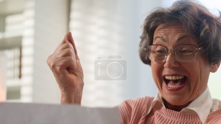 Photo for Happy Caucasian old woman reading paper letter middle-aged retired lady senior female mature granny retired grandmother excited win victory achievement good news euphoric celebrating bank loan approve - Royalty Free Image