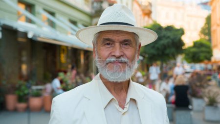Photo for Close up calm old senior 60s elderly mature gray-haired Caucasian elegant man retired businessman intelligent male tourist looking camera outside city street older portrait of patient medical service - Royalty Free Image