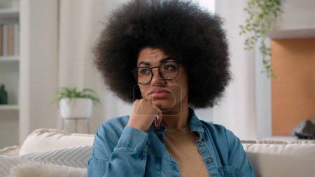 Photo for Close up sad pensive boring female portrait at home ethnic upset dissatisfied puzzled confused girl alone thoughtful stress anxiety worried African American woman thinking suffering solving problem - Royalty Free Image
