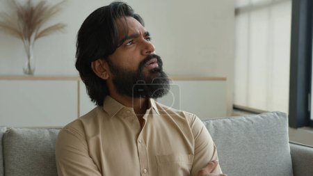 Photo for Thoughtful man Arabian muslim guy think idea indian male homeowner looking away dreaming thinking deep thought solve problem consider decide brainstorming at home pensive businessman ponder solution - Royalty Free Image