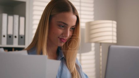 Photo for Caucasian woman student using laptop computer paperwork studying working home office online business girl businesswoman with papers documents check data bills managing finances checking budget smiling - Royalty Free Image
