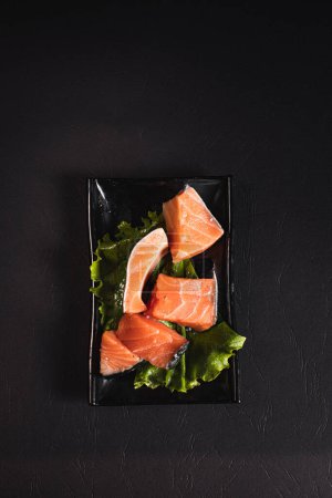 Photo for Red and fresh salmon fish meat.Garnish. View from above. Chinese cuisine, hotpot ingredient - Royalty Free Image