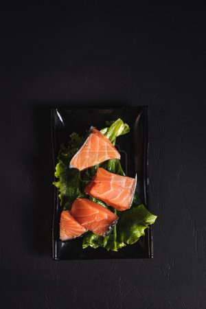 Photo for Red and fresh salmon fish meat .Garnish. View from above. Chinese cuisine, hotpot ingredient - Royalty Free Image