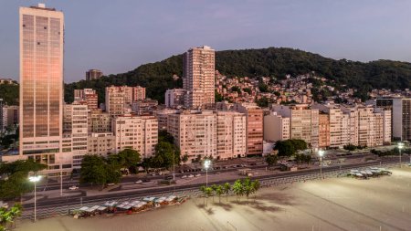 Téléchargez les photos : Aerial drone view of Leme neighbourhood in Copacabana with Babilonia favela in the background at sunrise, Rio de Janeiro, Brazil - en image libre de droit