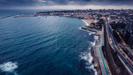 Photo for Aerial drone view of Marginal Avenue and coastline with looking west towards Cascais on a cloudy autumn day. - Royalty Free Image