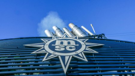 Photo for Palma Mallorca, Spain - November 20, 2023: Steam from the chimney of the MSC Seaview cruise ship escape smoke and exhaust fumes - Royalty Free Image