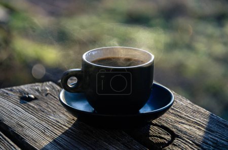 Photo for A cup of morning coffee on the terrace, during the sunrise. For coffee fans, against all odds. - Royalty Free Image