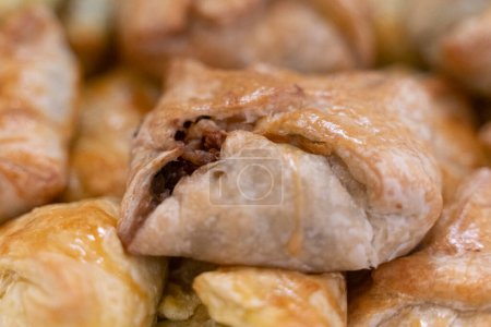 Photo for Puff pastry filled with minced beef meat , ideal starter for catering - Royalty Free Image