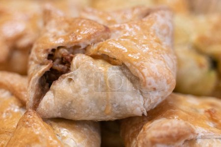 Photo for Puff pastry filled with minced beef meat , ideal starter for catering - Royalty Free Image
