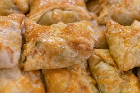 Photo for Puff pastry filled with Feta , Parmesan and spinach , ideal starter for catering - Royalty Free Image