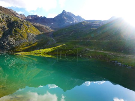 View on a Weissee lake in Kaunertal valley on a summer evening,mountains, sky, clouds.  Alps, Austria.  