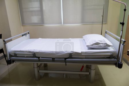 Photo for Empty adjustable patient bed in recovery  room at hospital ward - Royalty Free Image