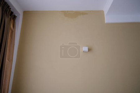 Photo for Darkened room wall, dilapidated walls and wet ceiling, gray mold on plaster, concept destruction of buildings from dampness, neighbors flooded roof leaks, Low Income Neighborhoods, emergency housing - Royalty Free Image