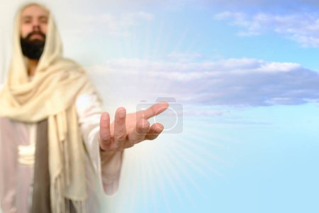 Photo for Biblical scene, Jesus Christ Hand against sky ask for follow or following as offer or offering, young pensive bearded and mustachioed man, guy 30 years in image of Savior, concept Holy Scriptures - Royalty Free Image