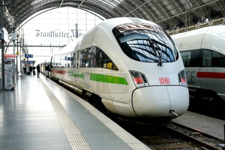 Photo for High-speed ICE train, ice-sprinter of Deutsche Bahn on platform Frankfurt am Main station, passengers with luggage, backpack go to board, europe voyage, boarding travelers, Frankfurt - March 2023 - Royalty Free Image