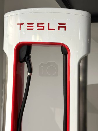 Photo for Demonstration model of TESLA Superchargers to recharge battery of cars American company Elon Musk in showroom, electric vehicle manufacturer, electric energy storage concept, Frankfurt - January 2023 - Royalty Free Image