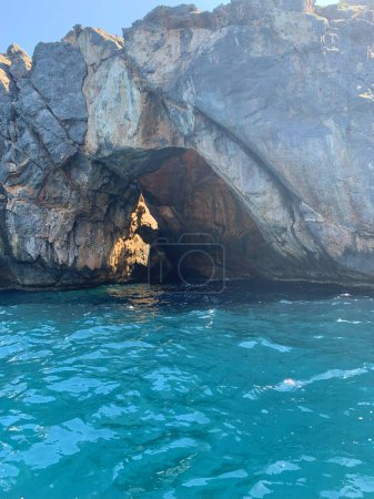 Photo for Tourist attraction explore grottoes, cave with hole at top, mediterranean sea, clear turquoise water, adventure, exploration under water caves, active sport, wonderful vacation, lack drinking water - Royalty Free Image