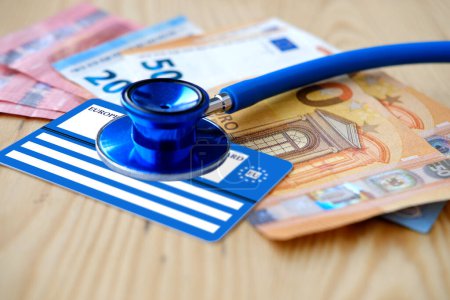 Photo for European health insurance card, euros money, medical stethoscope, concept international Travel insurance EU and EFTA traveling, medical support on trip to Europe, healthcare coverage, peace of mind - Royalty Free Image