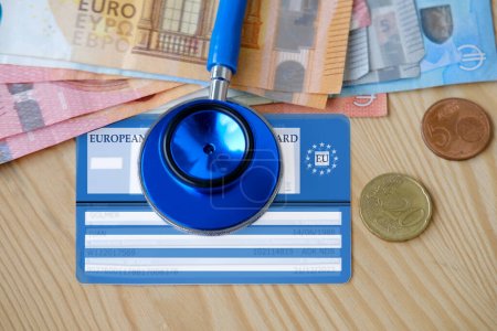 Photo for European health insurance card, euros money, medical stethoscope, concept international Travel insurance EU and EFTA traveling, medical support on trip to Europe, healthcare coverage, coverage abroad - Royalty Free Image
