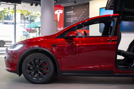 Photo for Ultra Red electric vehicle Tesla model X in Studio, SUV Powertrain in showroom, Green Driving, alternative energy development concept, Elon Musk company, Frankfurt, Germany - September 26, 2023 - Royalty Free Image