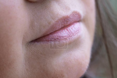 Photo for Close up lips of mature female face, happy 50-year-old woman with gentle smile, Cosmetology and Skincare concept, Maturity and Active Living, and joyful life - Royalty Free Image