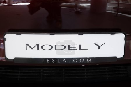 Photo for Back part of Tesla car model Y in cherry red color with logo in Studio, electric vehicle in showroom, li-ion 4680 battery, alternative energy, Elon Musk company, Frankfurt, Germany - September 2, 2023 - Royalty Free Image