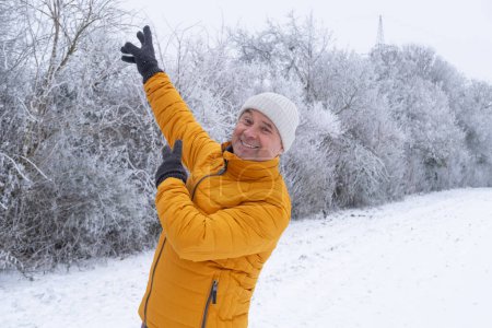 Photo for Happy man laughing in winter park, forest, happiness and enjoyment people experience in winter, especially in natural settings, positive impact of nature on mental health, even in colder seasons - Royalty Free Image