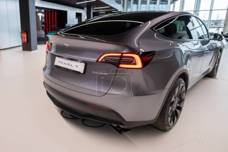 Photo for New grey electric tesla model y performance quicksilver rear view, automotive industry, crossover SUV produced by Tesla, EV in Europe, Environmental sustainability, Berlin, Germany - February 18, 2024 - Royalty Free Image