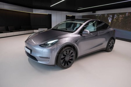 Photo for Tesla Model Y performance quicksilver battery electric mid-size crossover SUV produced Tesla, Environmental sustainability, Innovation automotive industry show in Berlin, Germany - February 18, 2024 - Royalty Free Image
