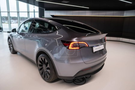 Photo for New grey electric tesla model y performance quicksilver rear view, automotive industry, crossover SUV produced by Tesla, EV in Europe, Environmental sustainability, Berlin, Germany - February 18, 2024 - Royalty Free Image
