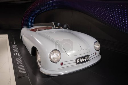 Photo for Vintage silver Porsche 356 Nr. 1 Roadster Cabrio classic car on display Porsche museum, automotive passion, evolution sports cars, Oldtimer car, retro-style, Stuttgart, Germany - January 26, 2024 - Royalty Free Image