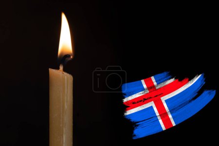 mourning candle burning front of flag Iceland , memory of heroes served country, grief over loss, national unity in challenging times, state's history