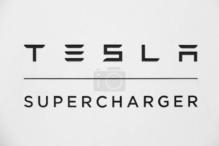 Photo for Logo Tesla supercharger v4 mit Lounge deutscher Fabrik Giga Berlin-Brandenburg Tesla location in Europe, sustainable and efficient facility yet in Berlin, Germany - February 19, 2024 - Royalty Free Image
