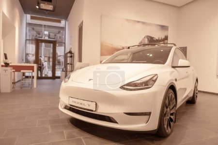 Photo for White Tesla electric car model Y in Studio, autopilot and eco-friendly engines, ev Environmental sustainability, automotive industry and reducing carbon emissions, Berlin, Germany - February 17, 2024 - Royalty Free Image
