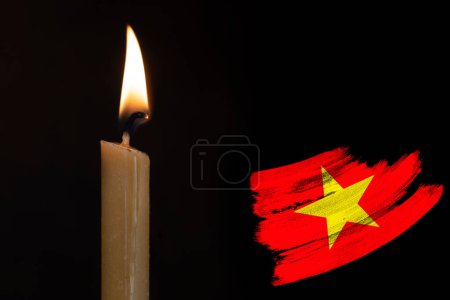 mourning candle burning front of flag Vietnam, memory of heroes served country, grief over loss, national unity in challenging times, state's history