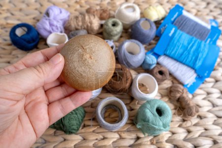 Photo for Wooden darning mushroom, clothing repair materials, home needlework, Exploring Textile Restoration, Sustainable DIY Fiber Projects - Royalty Free Image