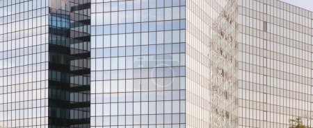 Photo for Fragments multi-storey office and residential buildings in European city with reflective glass facades, modern high-rise office buildings and residential towers, dynamism contemporary urban life - Royalty Free Image