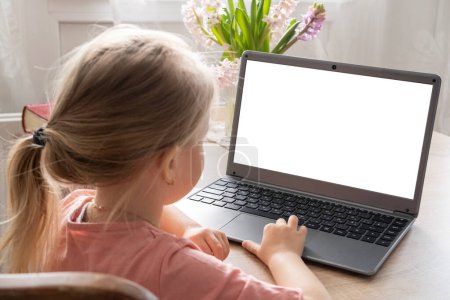 Photo for Preschool girl looking at empty blank mockup, distance learning course, using computer, monitor with white screen mockup, self-education, Parenting in digital age, prevention cybercrime, screen time - Royalty Free Image