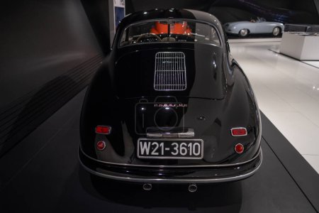 Photo for Vintage black Porsche 356 couple Ferdinand classic car on display Porsche museum, automotive passion, evolution sports cars, Oldtimer car, retro-style, Stuttgart, Germany - January 26, 2024 - Royalty Free Image