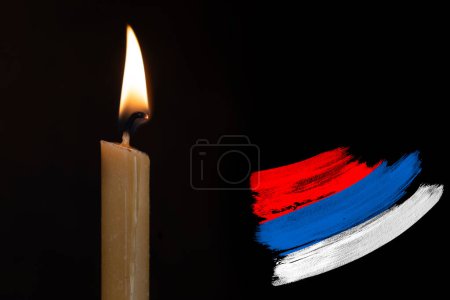 mourning candle burning front russian flag, memory of heroes served country, grief over loss, national unity in challenging times, state's history