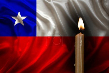 mourning candle burning front of flag Chile, memory of heroes served country, grief over loss, national unity in challenging times, state's history