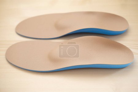 Photo for Orthopedic shoe inserts featuring supinator made of authentic leather, Experience Unmatched Comfort, Arch support, foot fatigue - Royalty Free Image