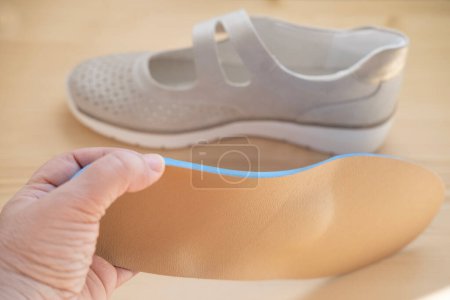 Photo for Orthopedic shoe inserts featuring supinator made of authentic leather, Experience Unmatched Comfort, Arch support, foot fatigue - Royalty Free Image
