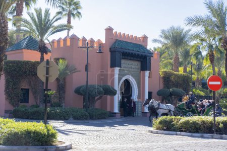 Photo for People go to Moroccan hammam, bathhouse, Red City Marrakech, authentic urban African landscape, daily activities and interactions people living in city Marrakech, Morocco - January 7, 2024 - Royalty Free Image