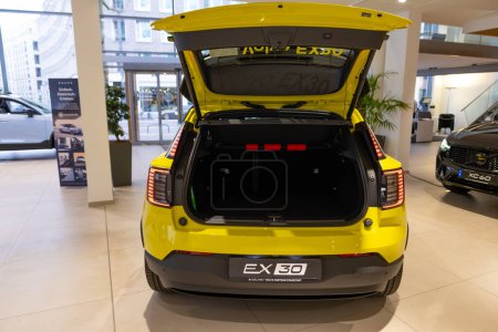 Photo for Open car trunk yellow Volvo EX30 electric SUV, showcasing sleek design, produced by Swedish automaker Volvo Cars, automotive industry, Sustainable Transportation, Frankfurt, Germany - March 4, 2024 - Royalty Free Image