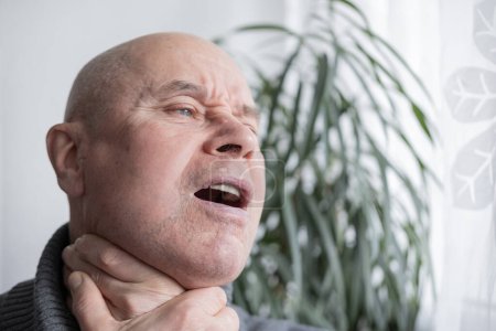 mature male neck, man patient holding affected area, experiencing throat pain, Health concern, loss of voice, various causes, tonsillitis
