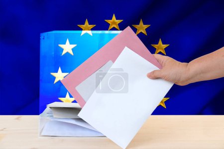 European election, female hand voter with ballot paper, transparent ballot box, political parties, voting rights, civic duty, citizen participation