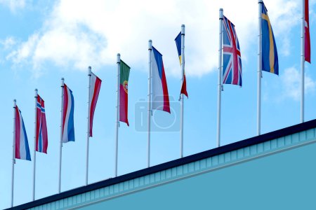 EU national flags in sky, government Buildings, European Space Agency, Parliament, Council Europe, Court Justice, European Commission, international cooperation