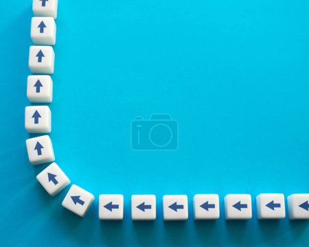 Photo for Blocks with chain arrows on a blue background. Moving forward, step by step. New opportunities. Strategic planning. Motivation, self-development. Set course, make your way. Copy space, place for text - Royalty Free Image