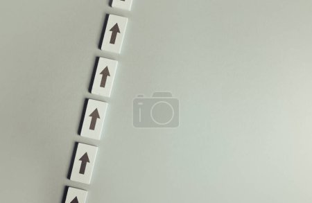 Photo for Row of arrows. Set course, make your way. Moving forward, step by step. New opportunities. Strategic planning. Motivation, self-development. Copy space, place for text - Royalty Free Image